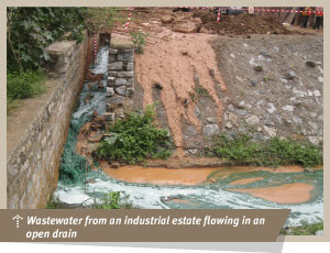 Wastewater from an industrial estate flowing in an open drain